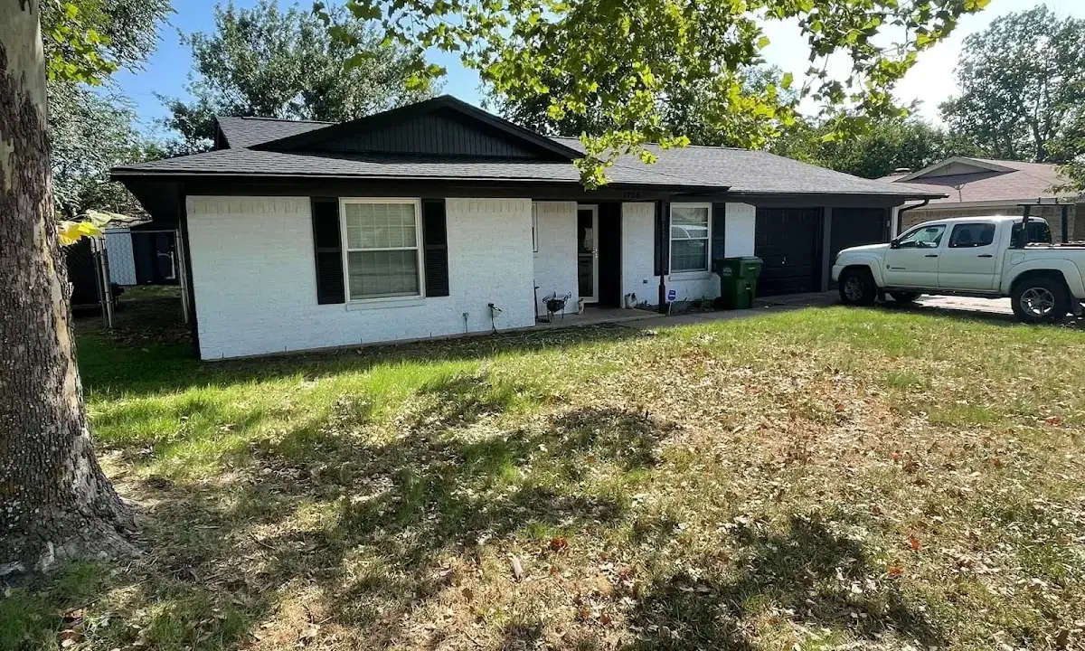 Professional roofing crew working on a residential roof in Jasmine Estates